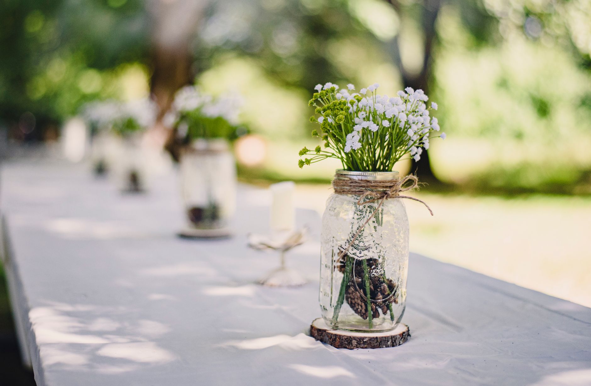 Wildflowers in a jar by a window