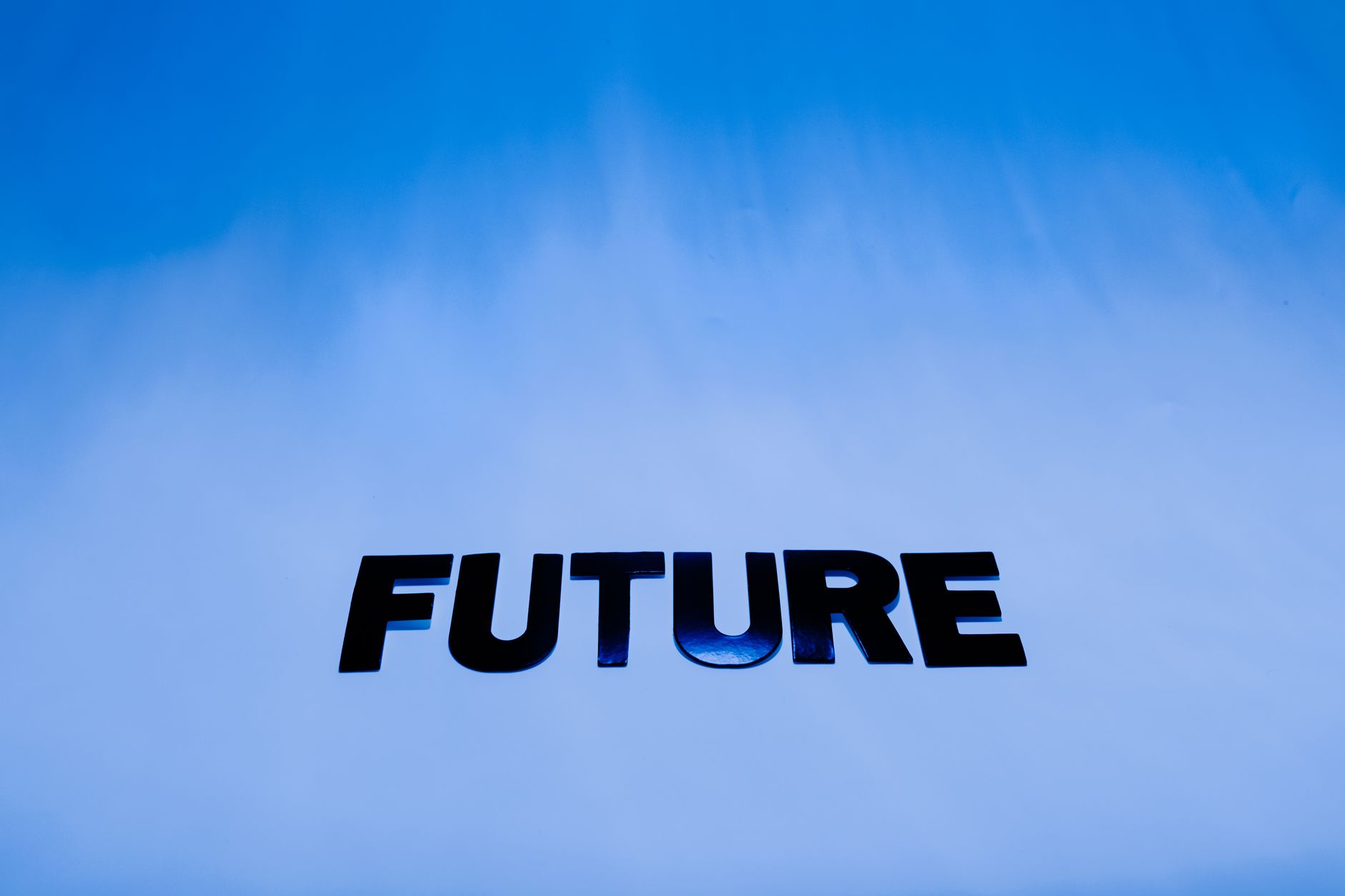 The word 'Future' in bold letters against a bright blue abstract background.