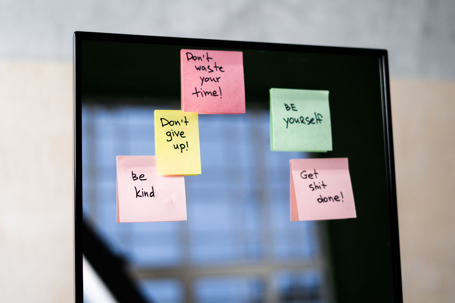 Sticky notes with kind messages on a mirror