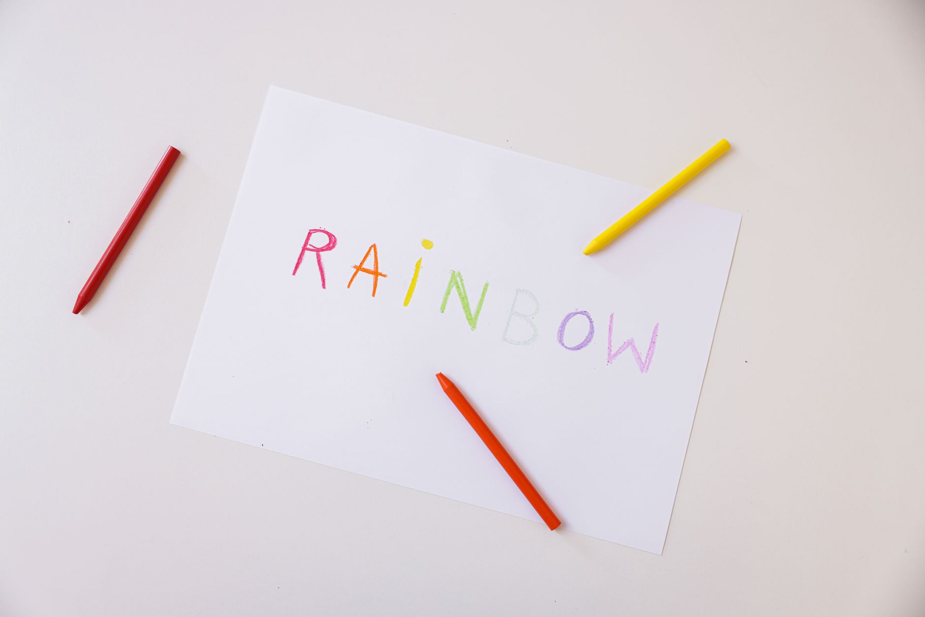 Crayons and drawing paper on a table