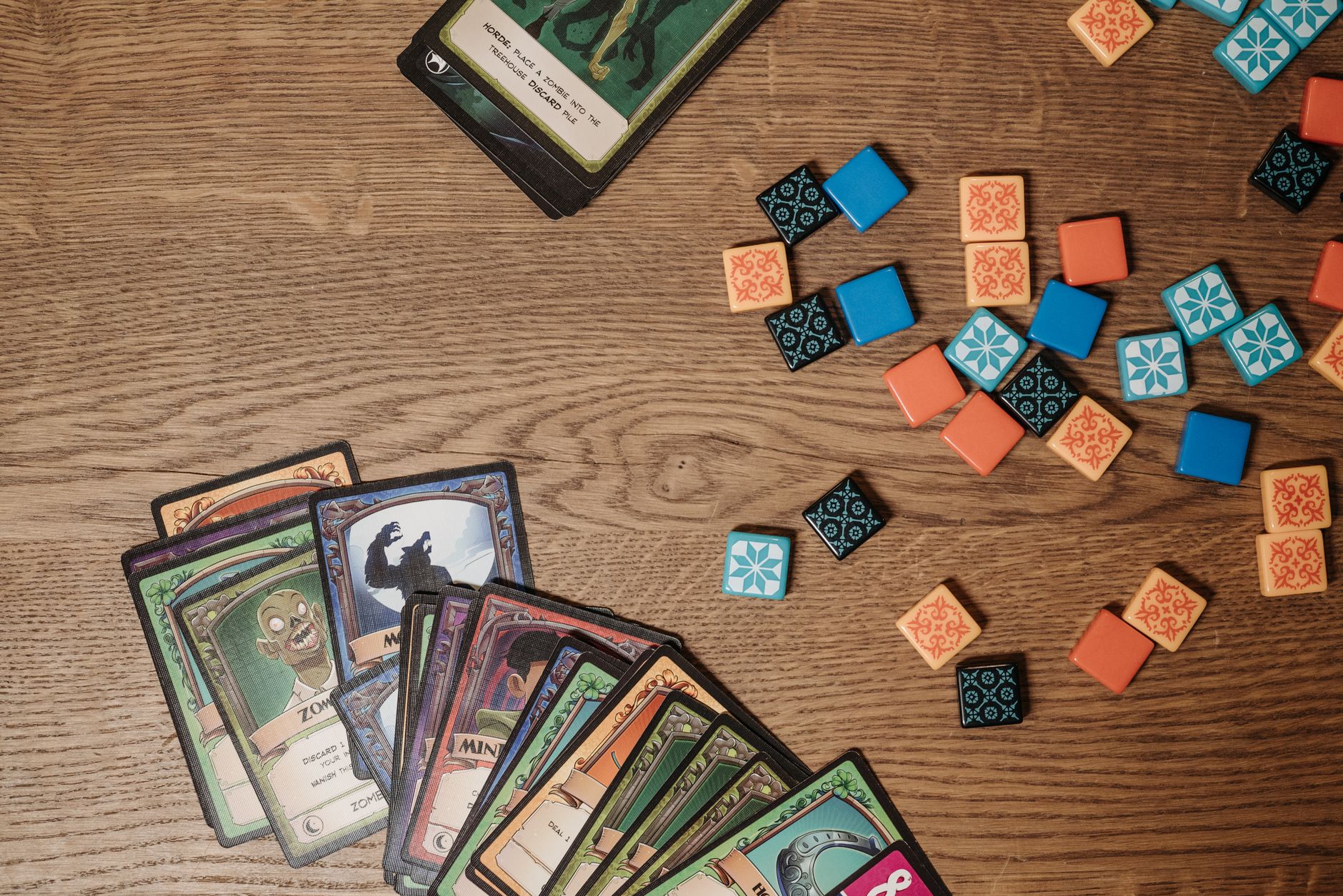 Board game pieces on a wooden table