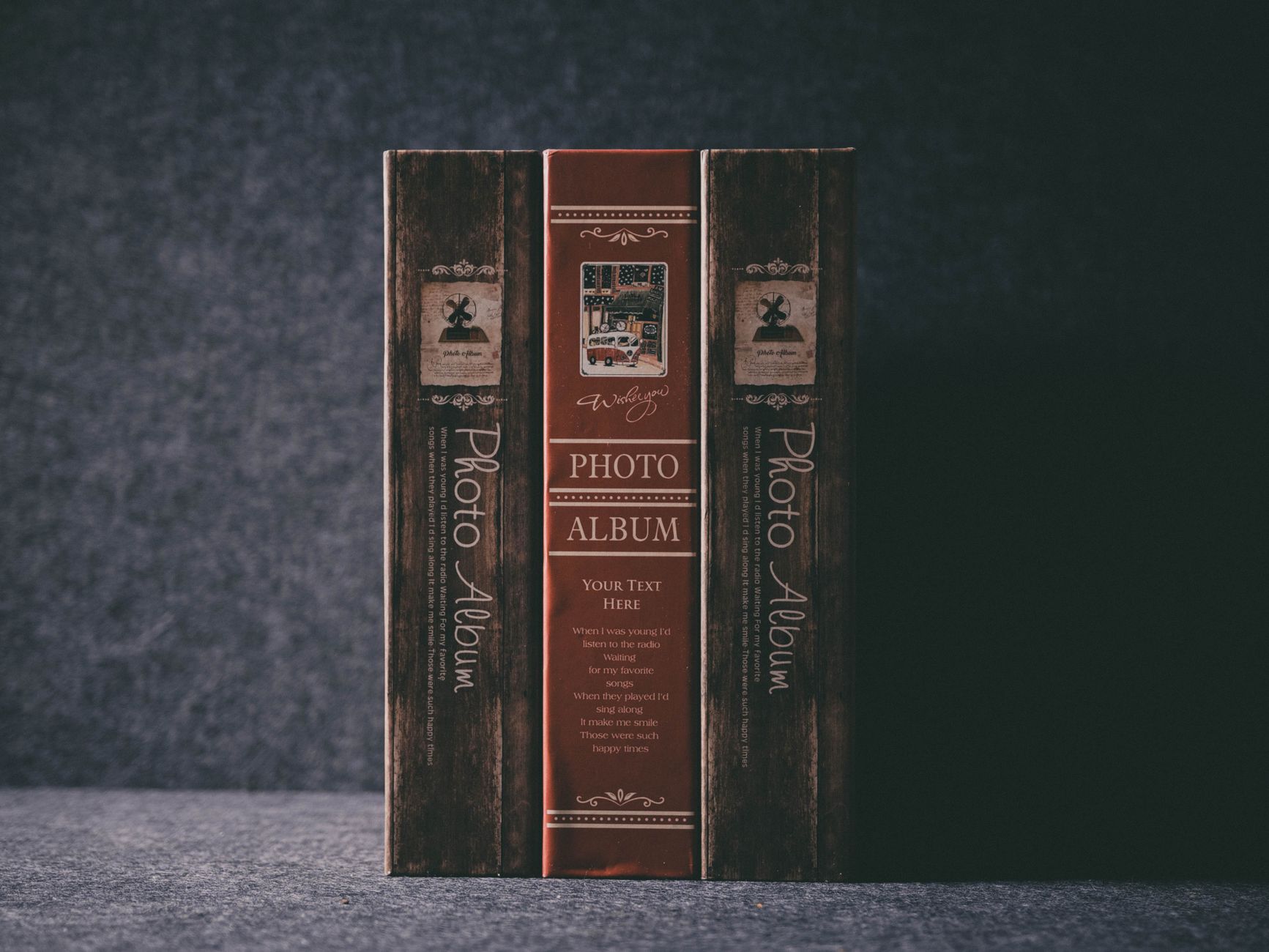 A photo album and picture frames on a table